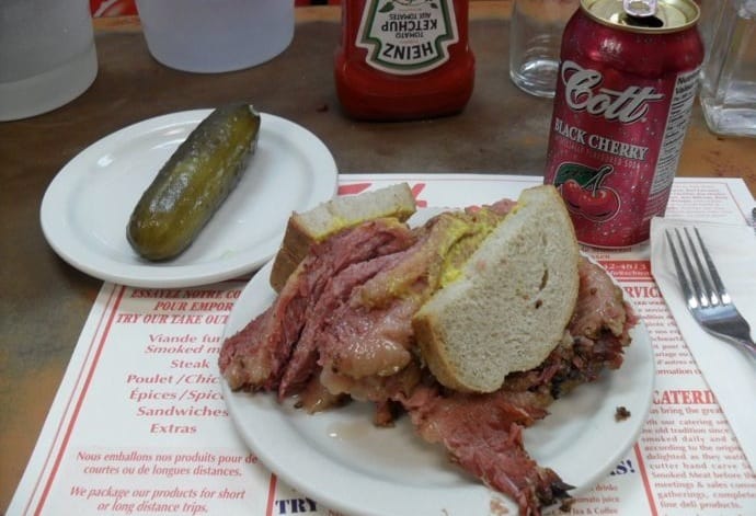 The must-have combo - smoked meat sandwich, cherry coke and pickles - from Schwartz's, Montreal's famous delicatessen