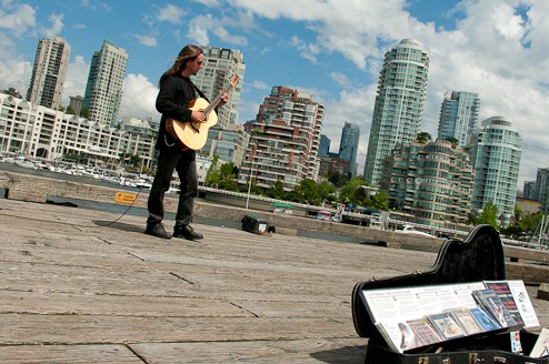 Les Finnigan, an award-winning, local guitarist performs regularly for visitors to Granville Island.