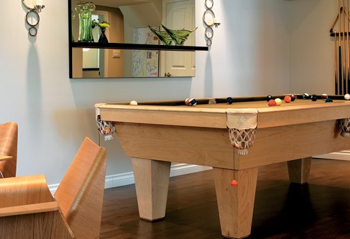 Pool table has custom cover to be transformed into a table