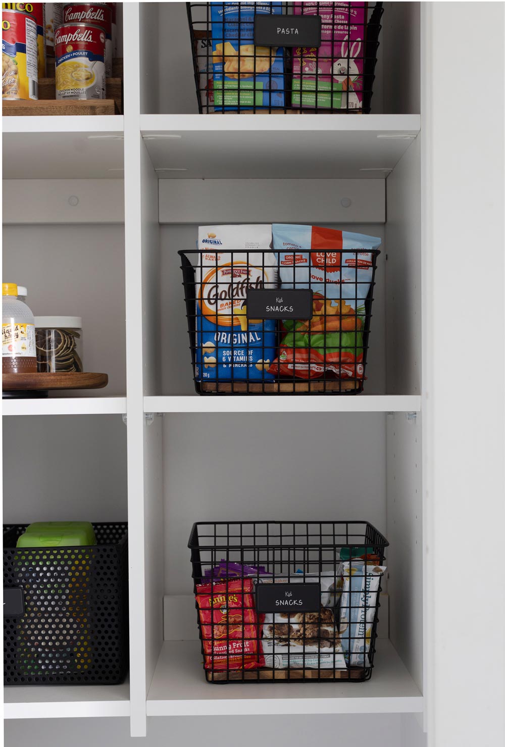 organized kitchen cabinet with grid baskets