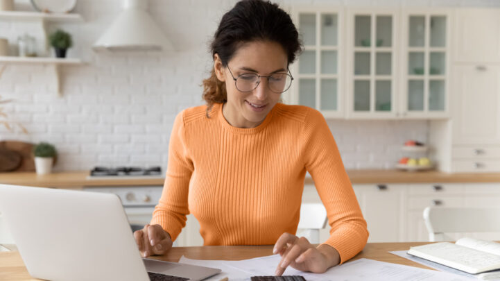 A woman checking the financial statements at home